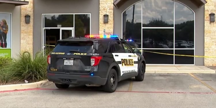 Man in critical condition after getting shot while laying carpet inside business